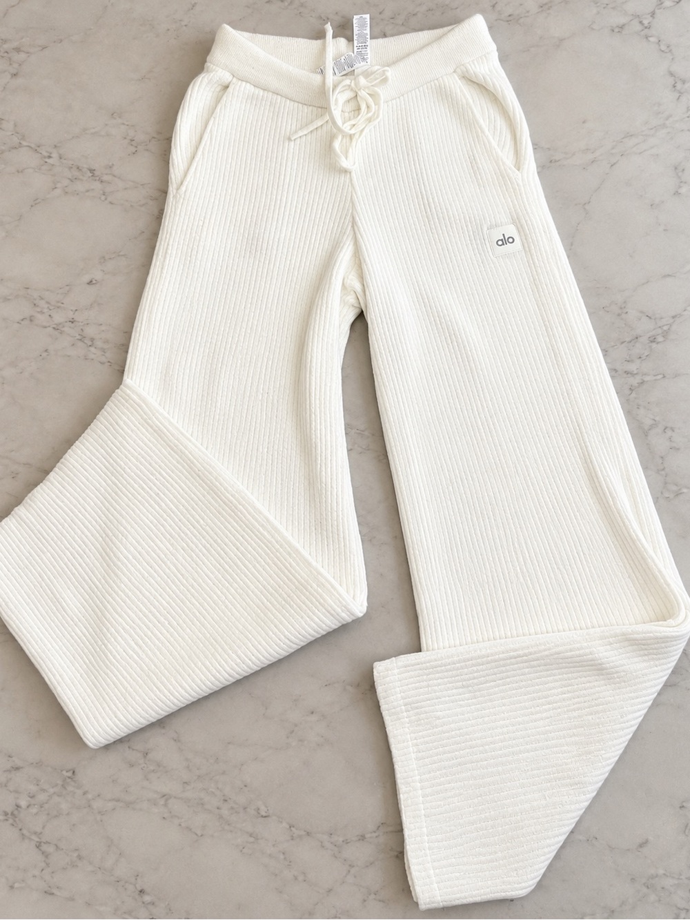ALO Yoga Snuggle Up High-Waist Wide Leg Pants in Ivory, size Medium.